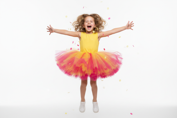Little Girl Jumping in Yellow Pink Tutu